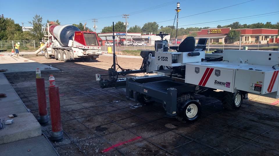 Somero laser screed and concrete mixer on a commercial pour